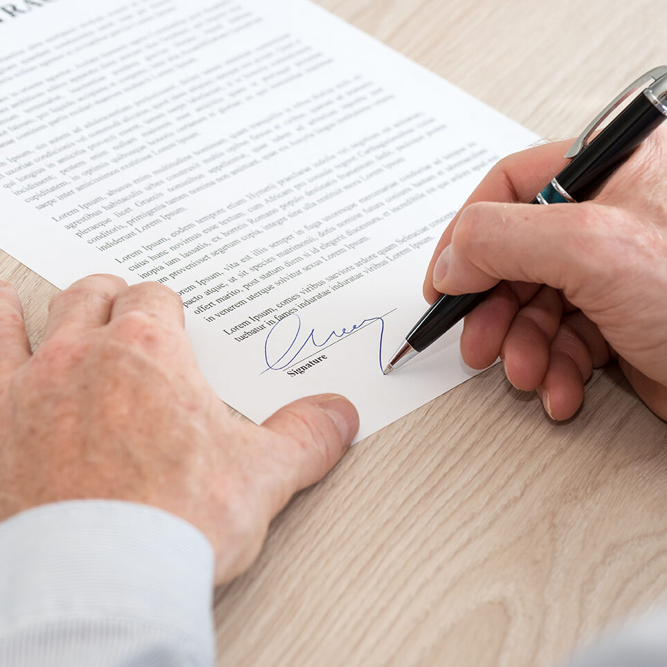 Man signing a legal document