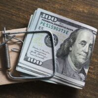 Deposits - depositphotos_722772540-stock-photo-100-dollar-bills-mousetrap-wooden